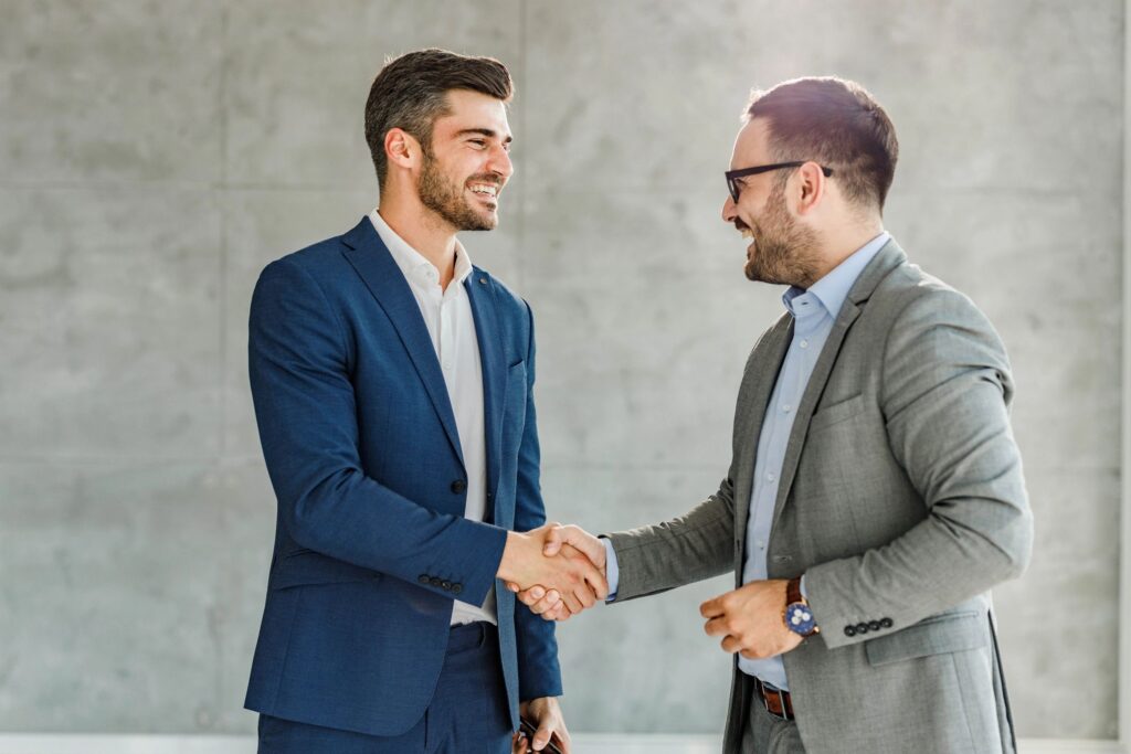 Happy businessmen came to an agreement in the office.